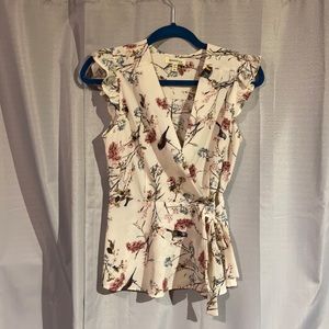 Medium peplum style top, gauze-like material, and fits very flattering.